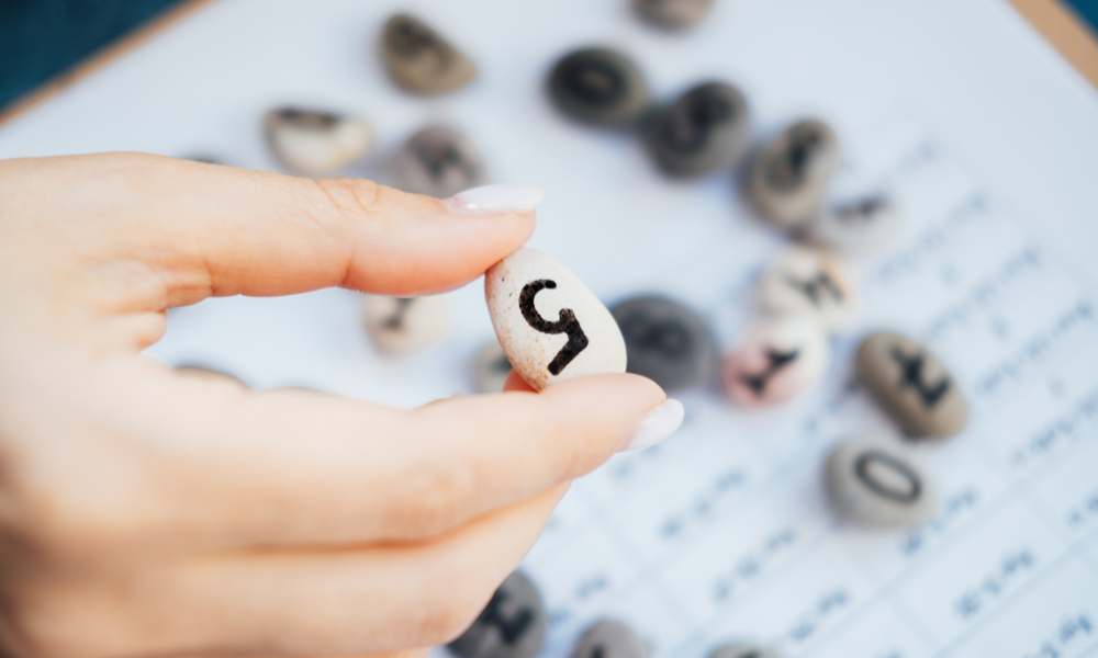 a small stone with number 5 written on it symbolizing number 5 in numerology