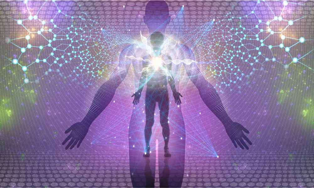 a shadowed image of a human with multi colored lines representing energy